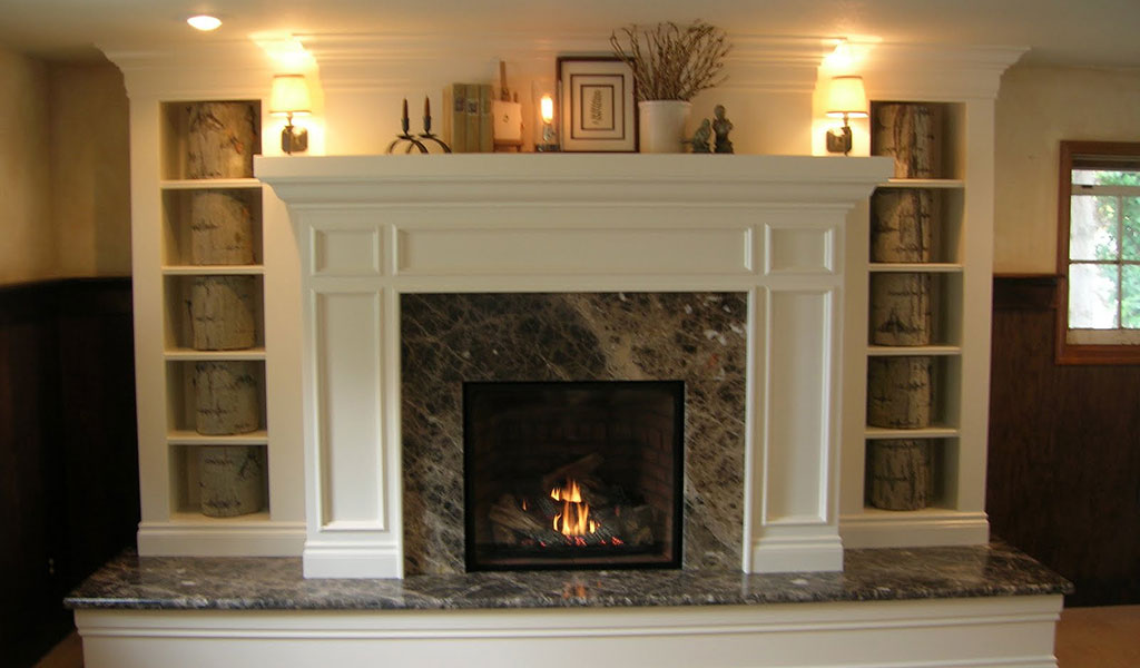 12 Cozy & Beautiful Fireplaces http://www.beautifuldesignmadesimple.com cozy fireplace with marble surround by Jared Rohrer Design